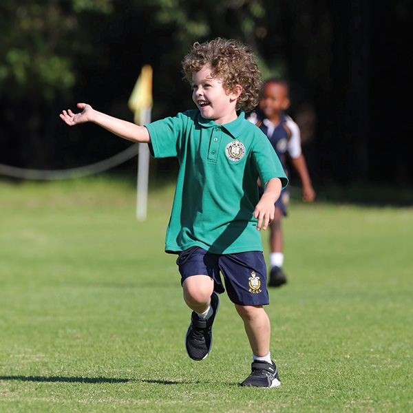 Connor running in a field